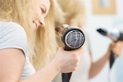 Blonde Woman Using Hair Dryer Stock Photo Image Of Happy Drying