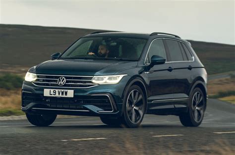 The volkswagen tiguan sets itself apart from other compact crossovers for its refined driving nature, practical interior, and optional third row of seats. Volkswagen Tiguan 2.0 TDI Elegance 2021 UK review review ...