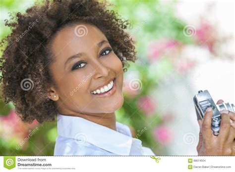 Mixed Race African American Girl Outside With Camera Stock Photo