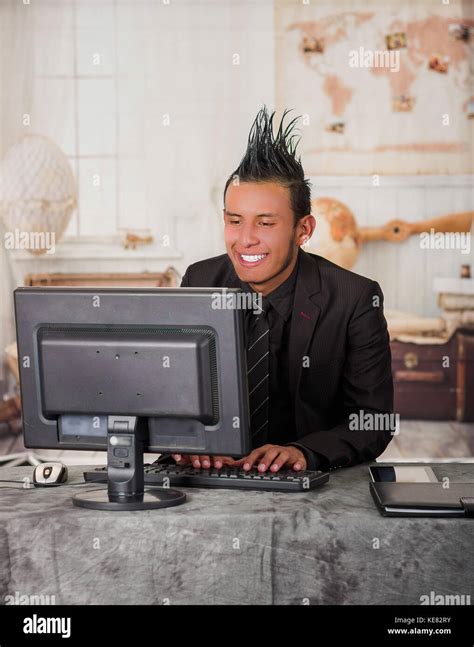 Close Up Of Smiling Office Punk Worker Wearing A Suit With A Crest