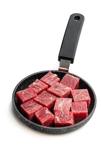 An easy way to make a beef dish stand out. Cubes Of Raw Beef Meat On Small Frying Pan Isolated On White Stock Photo - Download Image Now ...