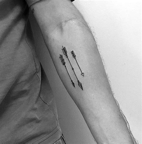 Three Small Arrows Tattoo On Inner Forearm