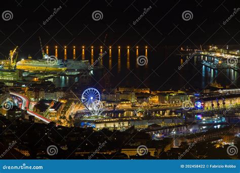 Aerial View Of Genoa By Night The Ancient Harbor With The Ferris Wheel