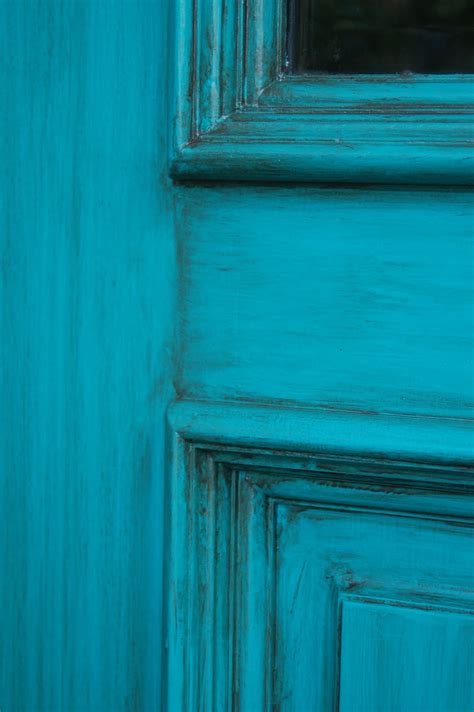 Everything from their shape, to their color, to the doorknocker hanging on the front can give visitors an immediate impression. Turquoise Front Door - Sonya Hamilton Designs