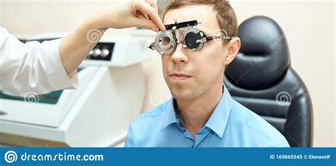 Ophthalmologist Doctor In Exam Optician Laboratory With Male Patient. Men Eye Care Medical ...