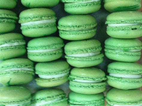 Green Macaroons Stacked On Top Of Each Other