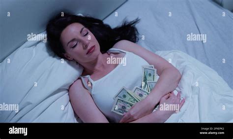 Woman Sleeping On Bed With Bundle Of Currency Notes Stock Photo Alamy