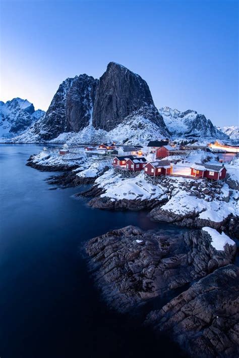 Fishermens Cabins Rorbu In The Hamnoy Village At Twilight In Winter