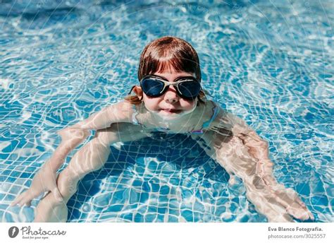 Beautiful Kid Girl At The Pool Diving With Water Gogglessummer A