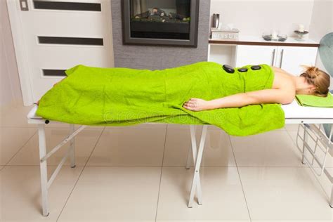 Beauty Salon Woman Getting Spa Hot Stone Therapy Massage Stock Image Image Of Pampering