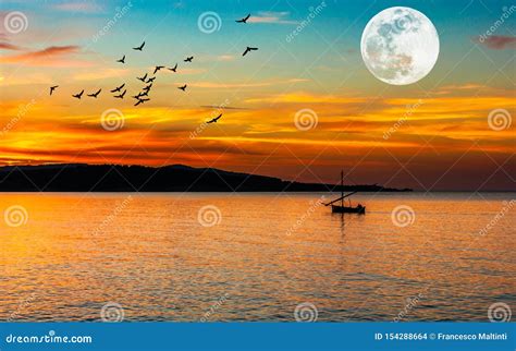 Fishing Boat On The Coast At Sunset Stock Photo Image Of Morning