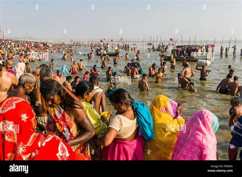 People Taking Bath At The Sangam The Confluence Of The Rivers Ganges