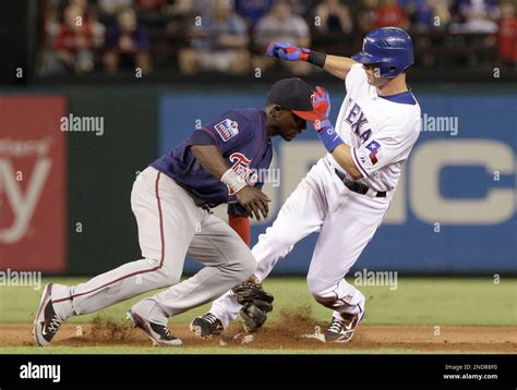 Texas Rangers Michael Young Right Beats The Tag Of Minnesota Twins