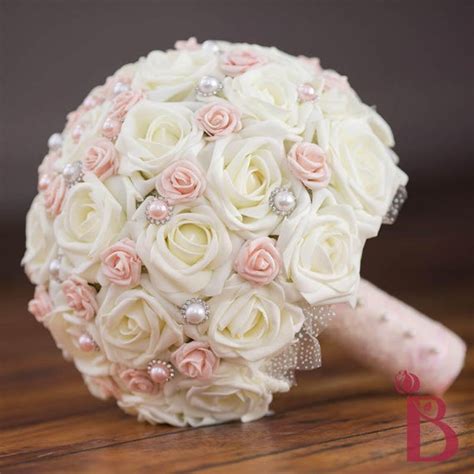 Coral pink peach and ivory white burlap rustic wedding bouquet boutonniere. Blush pink wedding bouquet ivory and pink bridal bouquet