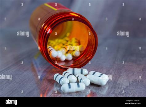 Prescription Medication Bottle And Pills Gray Wood Background Orange
