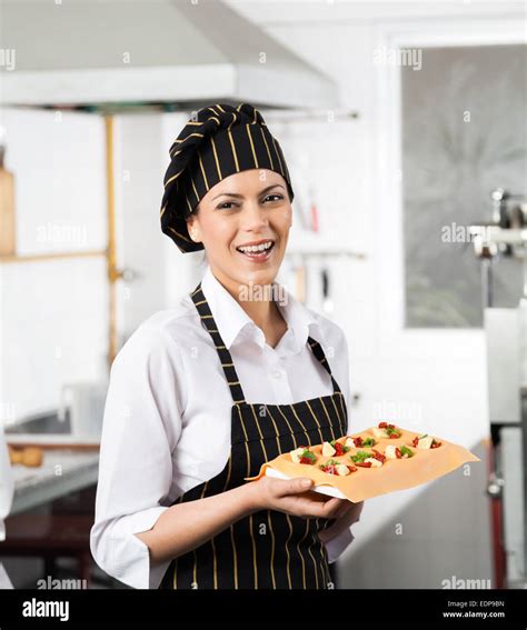 Happy Chef Holding Tray With Stuffed Pasta Sheet Stock Photo Alamy
