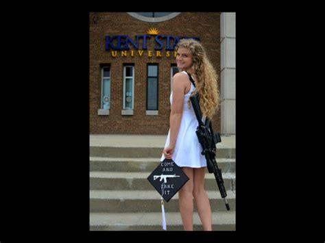 female kent state graduate carries ar 10 on campus