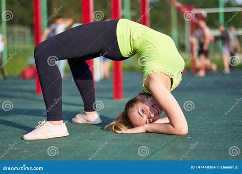 woman doing exercise bridge stretching danser or gymnast training trains in workout sports
