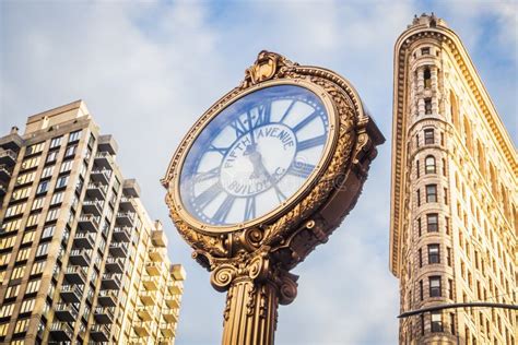The Iconic Golden Clock Of Flatiron Building In Midtown Manhattan
