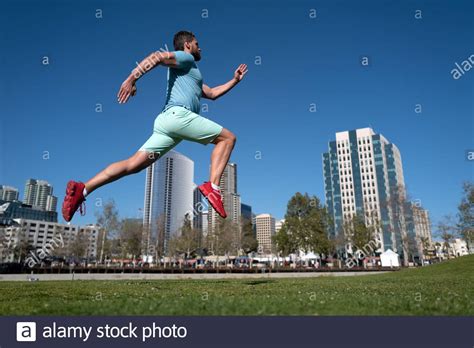 Athletic Young Man Running In City Dynamic Jumping Movement Young And