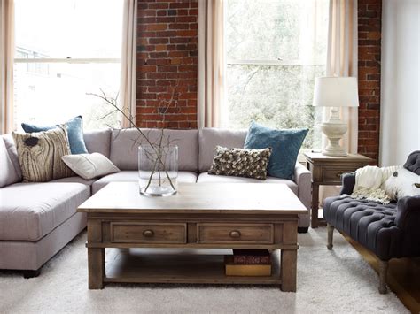Country living room features a limestone fireplace with charcoal gray surround under a concealed tv hidden behind folding doors. Modern Country Living - Traditional - Living Room ...