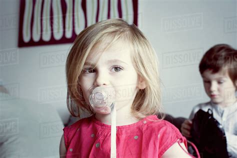 Little Girl Sucking Pacifier Stock Photo Dissolve