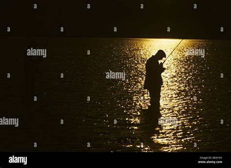 Fisherman In Sunset Stock Photo Alamy