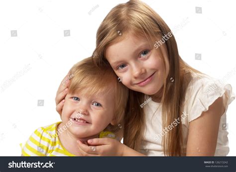 Two Little Sisters One Hugs Another Stock Photo 126213242 Shutterstock
