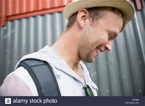 Portrait Smiling Young Man Looking Down Stock Photo Alamy