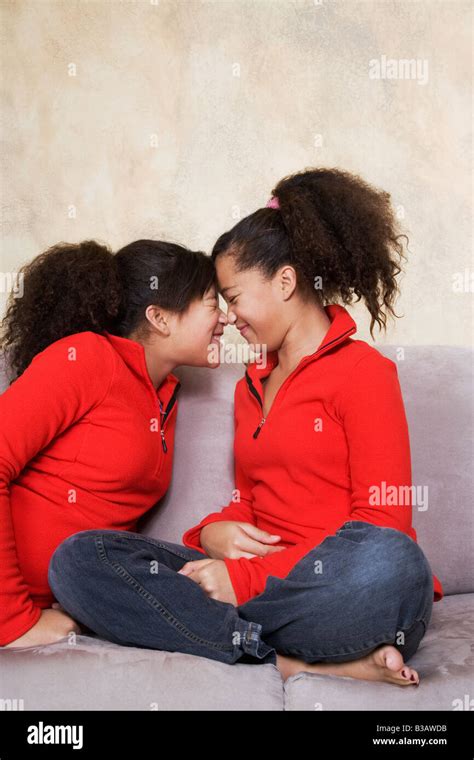 African Twin Sisters Rubbing Noses Stock Photo Alamy