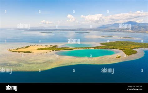 Tropical Island With Mangroves And Turquoise Lagoons On A Coral Reef