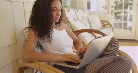 Young Attractive Hispanic Woman Typing On Her Laptop Computer Stock Image Image Of Internet