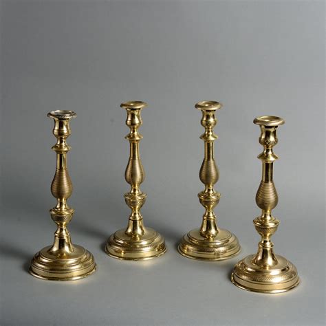 A Set Of Four 19th Century Large Brass Candlesticks Candlesticks