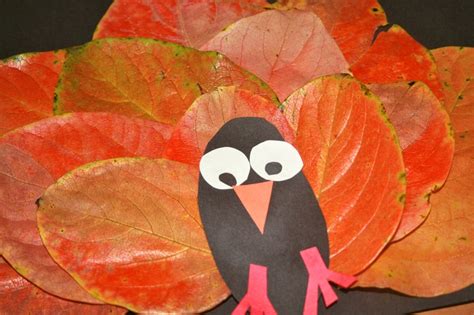 thanksgiving turkey craft made with flattened leaves and construction paper thanksgiving