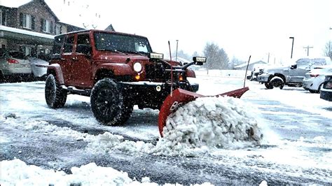 Plowing Snow With A Jeep Wrangler And Boss Htx V Plow Snow Removal Of