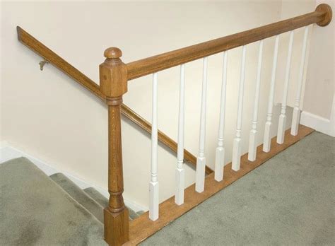 The banister has spindles that go through the carpet into the ground. Replace a stair railing | Banister remodel, Sleek decor ...