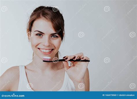 Girl Shows The Finger On The Toothbrush Smile Teeth Stock Photo Image