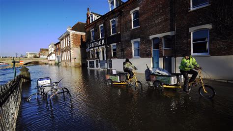 Record rainfall caused rivers to burst their banks, devastating the region. Severe flood warnings issued as more rain lashes the north ...