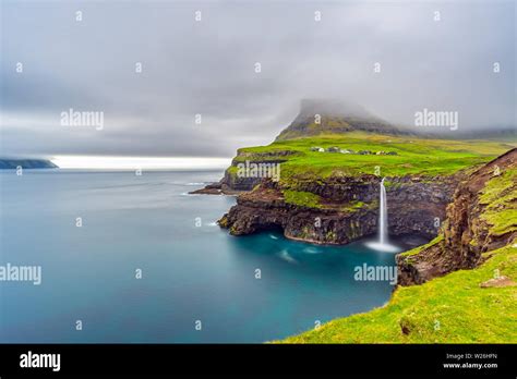 Gasadalur Waterfall Long Exposure In Faroe Islands Misty Day Stock