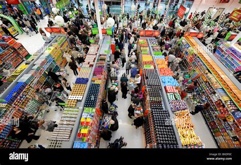 A Busy Supermarket Store Customers Queuing In Aisles Stock Photo