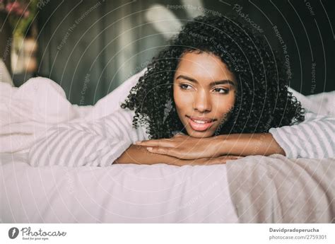 Beautiful Young Black Teenage Girl Lying Down In A Rug A Royalty Free