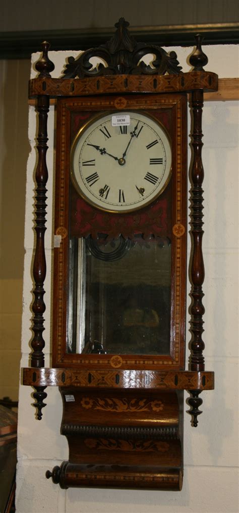 A Late 19th Century Walnut Cased Wall Clock With Eight Day Movement