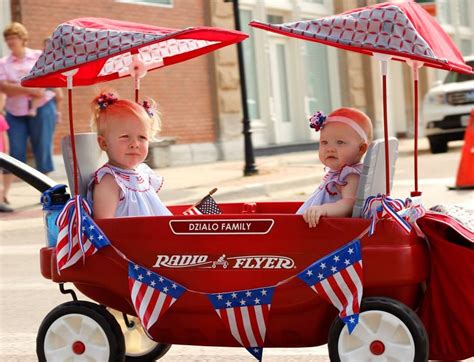 Parents Decorate Wagons To Present At The Fourth Of July Patriotic