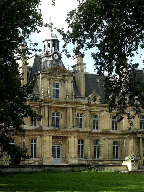 A Large Building With A Clock Tower On Top