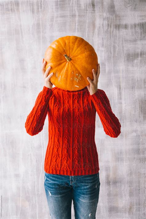 Woman Holding Pumpkin In Front Of Face Del Colaborador De Stocksy Danil Nevsky Stocksy
