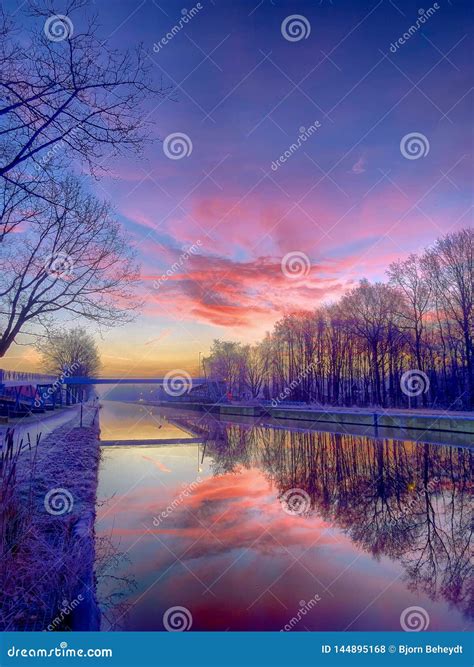 Dramatic And Colorful Sunrise Over A Beautiful River Landscape Stock