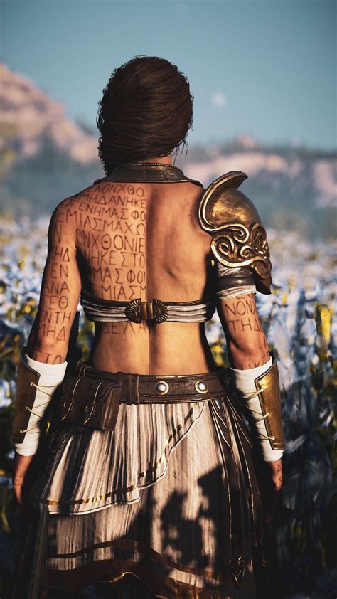 A Woman With Tattoos On Her Back Standing In A Field