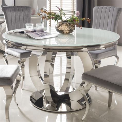 The camryn refectory dining table is constructed from pine veneer and hardwood solids and is finished in a rustic wire brushed white finish which gives this piece a rustic and vintage aesthetic. Round Dining Table Mirrored Finish White Glass Top Steel ...