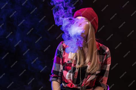 Premium Photo Vaping Girl Young Hipster Woman Vape E Cig On Studio