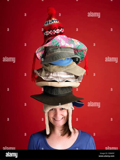 Woman Wearing Many Hats Stock Photo Alamy
